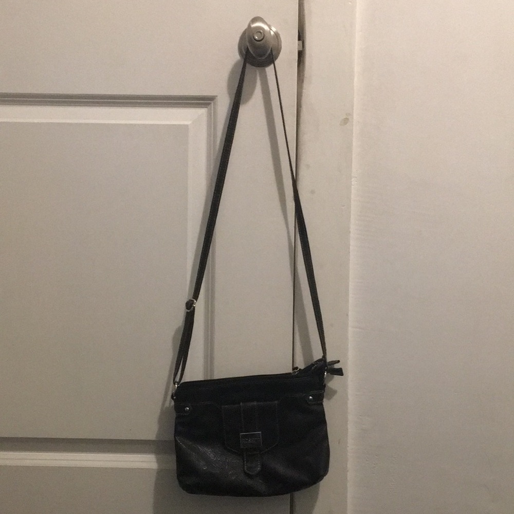 I am selling this black purse with name in front! Useful for everyday!